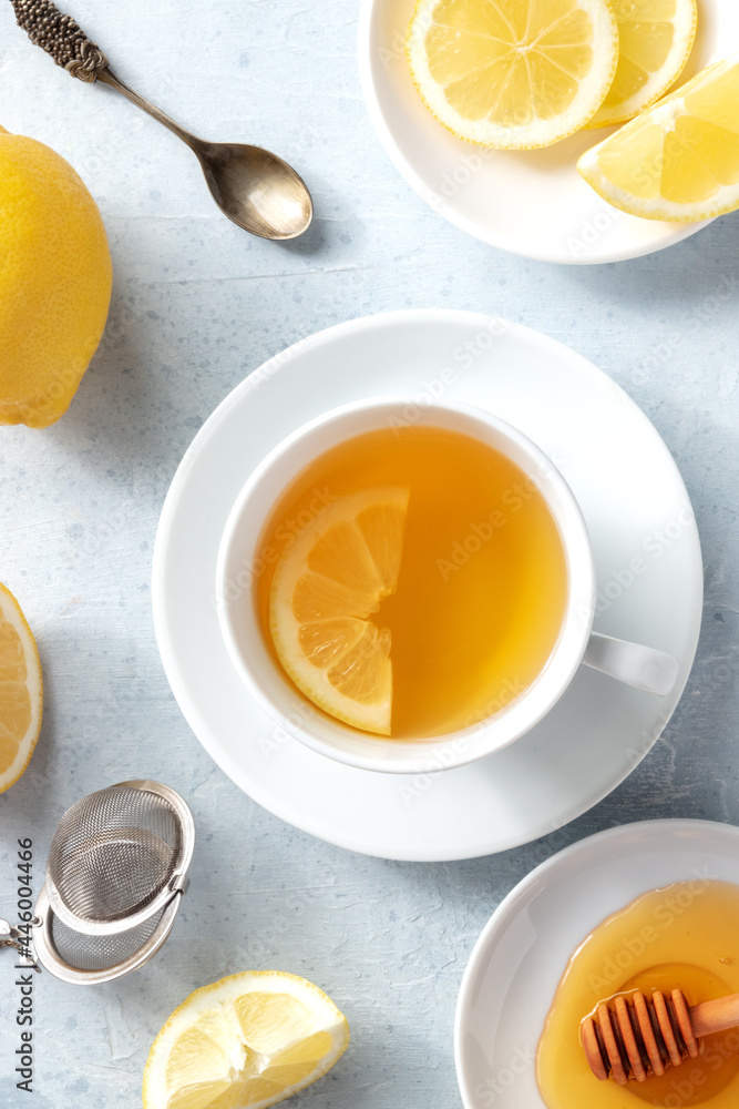 Lemon tea and honey, shot from above. Natural remedy. Healthy morning drink Lemon tea and honey, shot from above. Natural remedy. Healthy morning drink