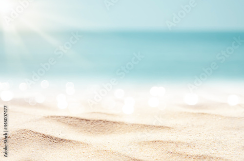 Blur tropical beach with bokeh sun light wave abstract background. photo