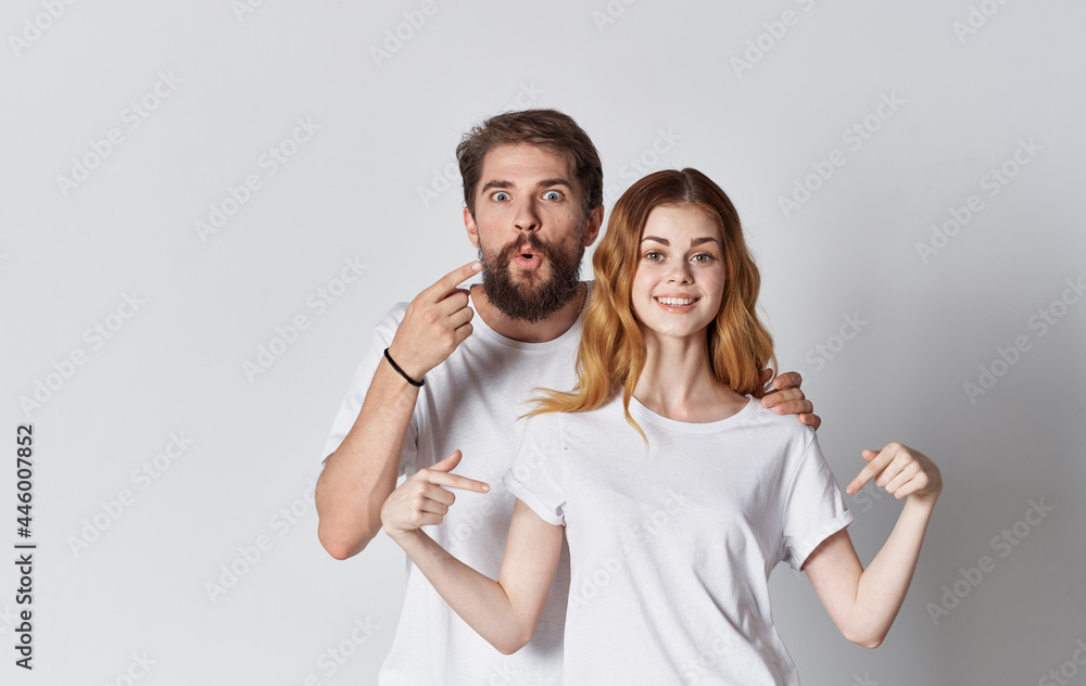 man and woman in white t-shirts advertising design man and woman in white t-shirts advertising design