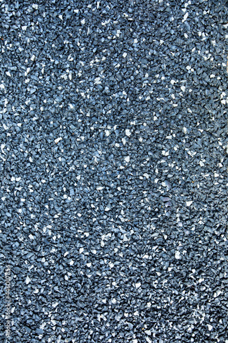 Gray rubber crumb, close-up, texture top view.