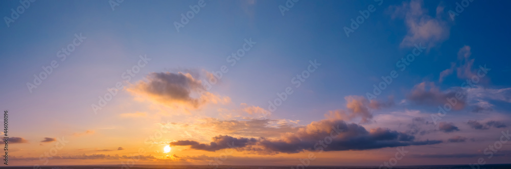 Fototapeta premium Dawn or sunset over the clouds, blue hour, aerial view.