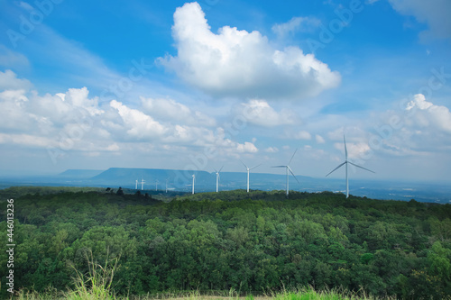 sky and clouds drift slowly in the wind in the sky. with the pure energy obtained from the white windmills standing lined