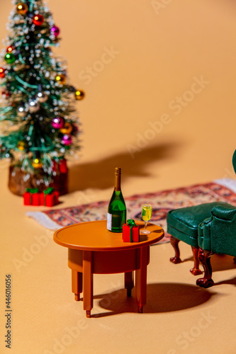 Closeup view on Christmas tree and drinks on a table in Eve night photo