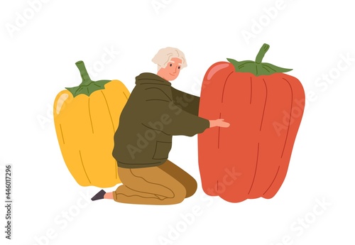 Happy tiny person holding huge sweet bell pepper. Vegetarian man with big fre...