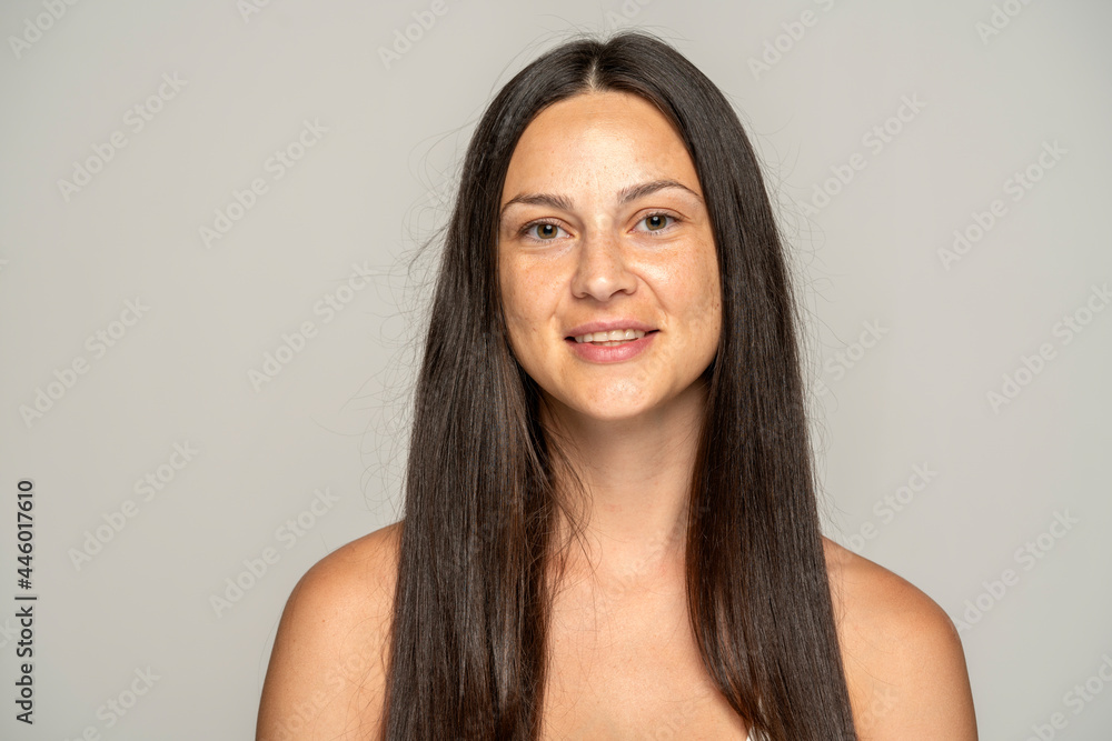 a young smiling woman without makeup with long hair a young smiling woman without makeup with long hair