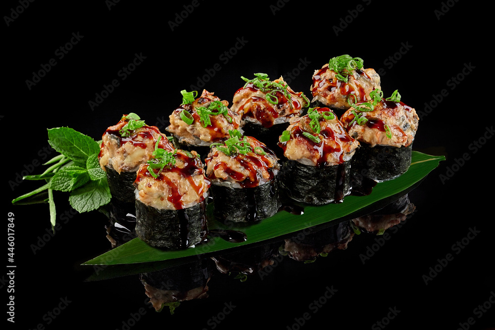 Baked maki sushi roll with eel, cream cheese, cucumber and unagi sauce Baked maki sushi roll with eel, cream cheese, cucumber and unagi sauce