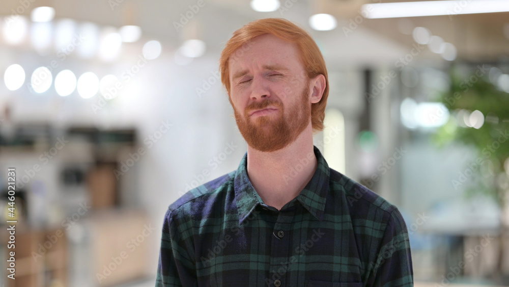 Portrait of Disappointed Redhead Man Reacting to Loss Portrait of Disappointed Redhead Man Reacting to Loss
