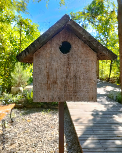 bird house made of wood that is outdoors  © lanny