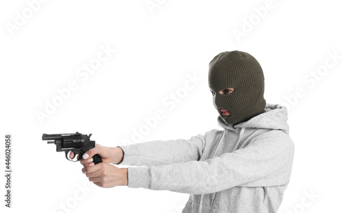Woman wearing knitted balaclava with gun on white background