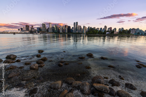 Panoramic view of beautiful Vancouver skyline and famous harbor area from stanley park in idyllic evening light at sunset in summer, British Columbia, Canada