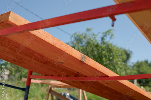 Photography Rough pine boards in antiseptic and fireproof impregnation