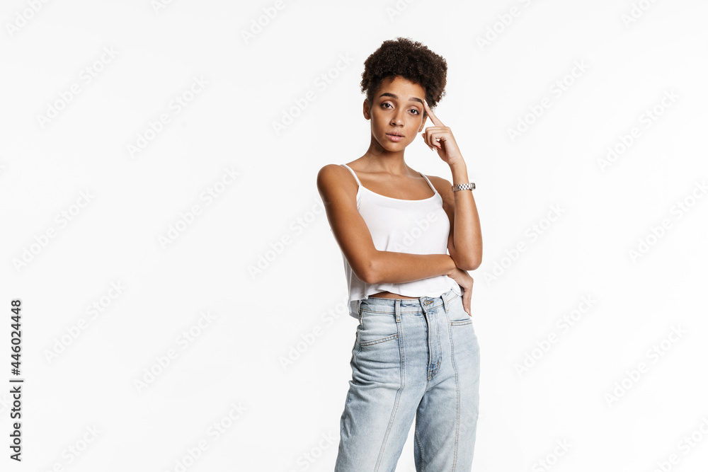 Young black woman in tank top posing and looking at camera Young black woman in tank top posing and looking at camera