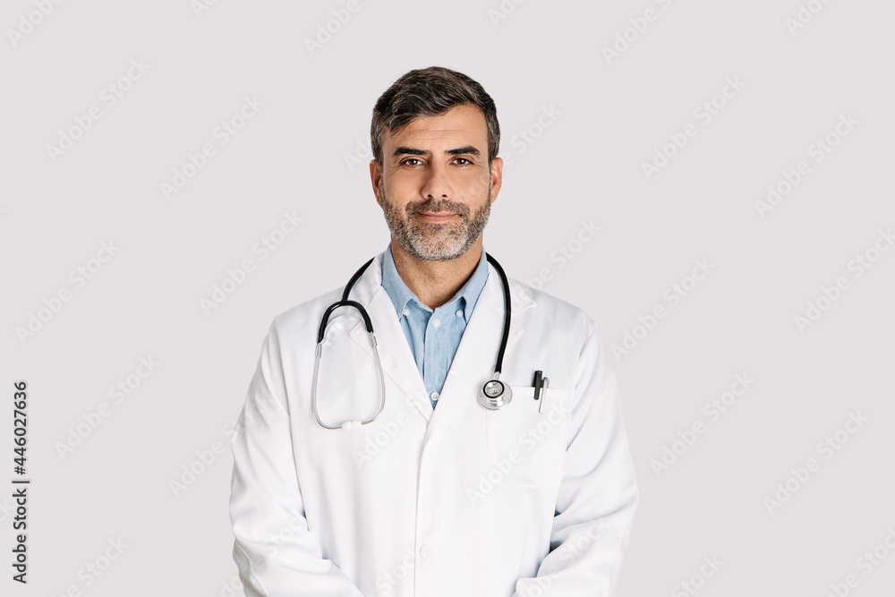 Male doctor standing on white background Male doctor standing on white background