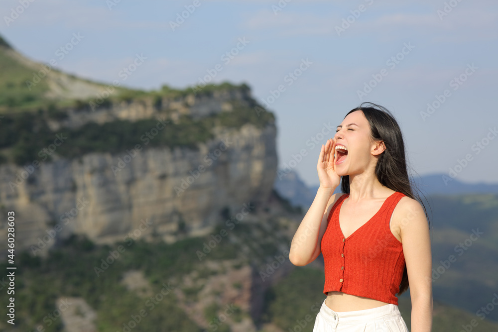 Asian woman screaming in the mountain on vacation Asian woman screaming in the mountain on vacation