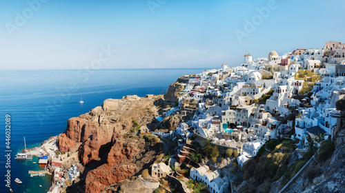 Santorini, Greece. Panoramic view of traditional houses in Santorini. Small narrow streets and rooftops of houses, churches and hotels. Oia village, Santorini Island, Greece. Travel and vacation photo