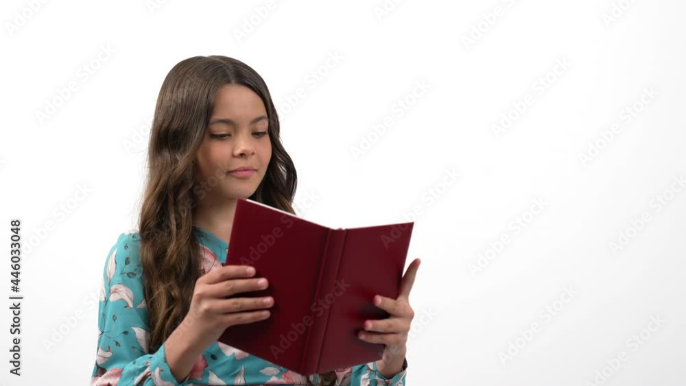 smiling child reader with educational book with amazed face isolated on white, knowledge. smiling child reader with educational book with amazed face isolated on white, knowledge.