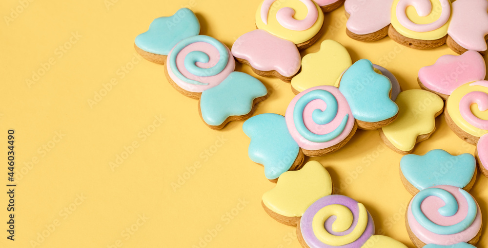Bright cookies in glaze on a yellow background copy space. Bright cookies in glaze on a yellow background copy space.