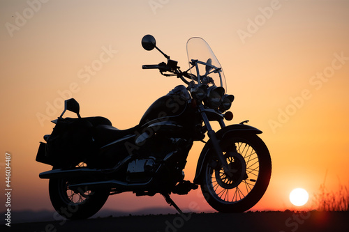 Motorcycle parking on the road right side and sunset