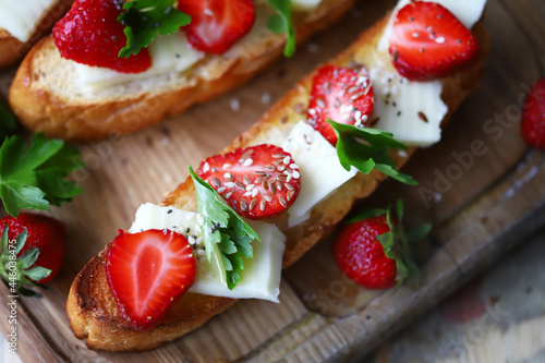 Delicious toast with strawberries and white cheese. Keto toast with strawberries.