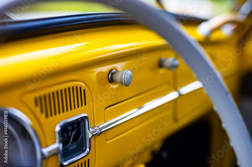 Restored yellow classic car interior. Photo taken in natural light. © Fotoforce