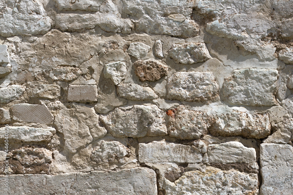 White old brick wall. Texture of a white antique stone wall. Grunge texture white brick background. Copy space. White old brick wall. Texture of a white antique stone wall. Grunge texture white brick background. Copy space.