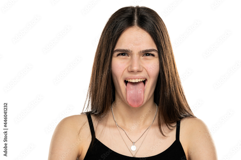 portrait of a beautiful teenage girl crawling her tongue portrait of a beautiful teenage girl crawling her tongue