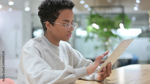 Young African Woman using Digital Tablet 