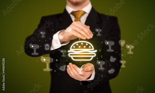 Hand holding food related icons