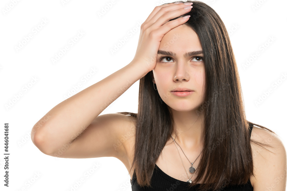 portrait of a beautiful teenage girl looking up and holding her head portrait of a beautiful teenage girl looking up and holding her head