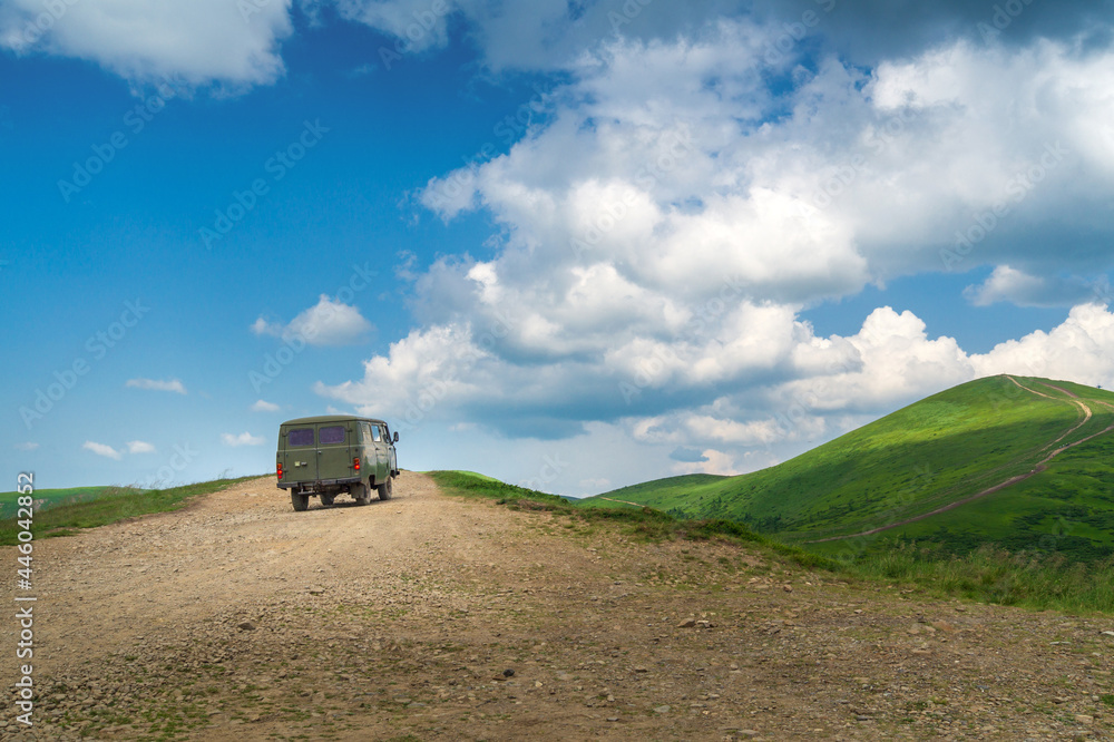 Travel to the top of the mountain on an old bus. Summer tourism and trekking to the mountains Travel to the top of the mountain on an old bus. Summer tourism and trekking to the mountains