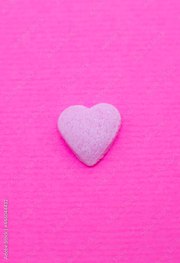 Pink heart on pink background. Saint Valentine's day concept. Love and romantic photo. Postcard for holiday. Beautiful warm wallpaper with love. Soft focus. Copy space.