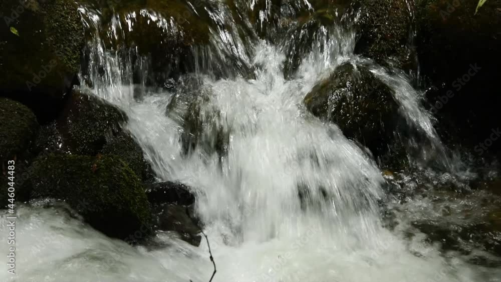 water flowing from the waterfall water flowing from the waterfall