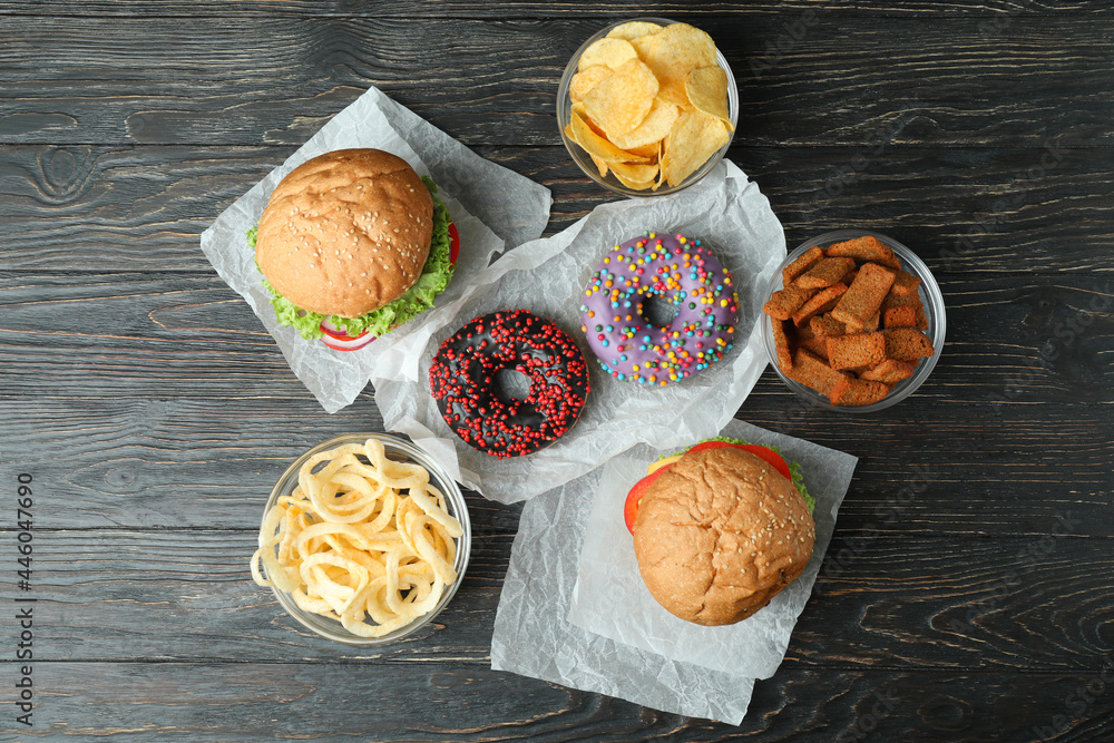Tasty fast food on rustic wooden table Tasty fast food on rustic wooden table