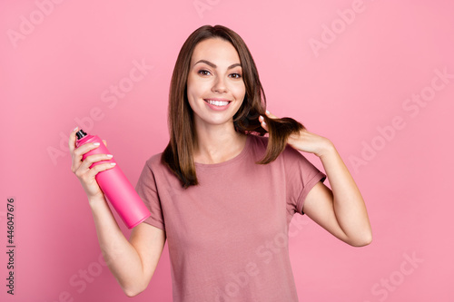 Photo of cool brunette young lady do hair wear t-shirt isolated on pink color background