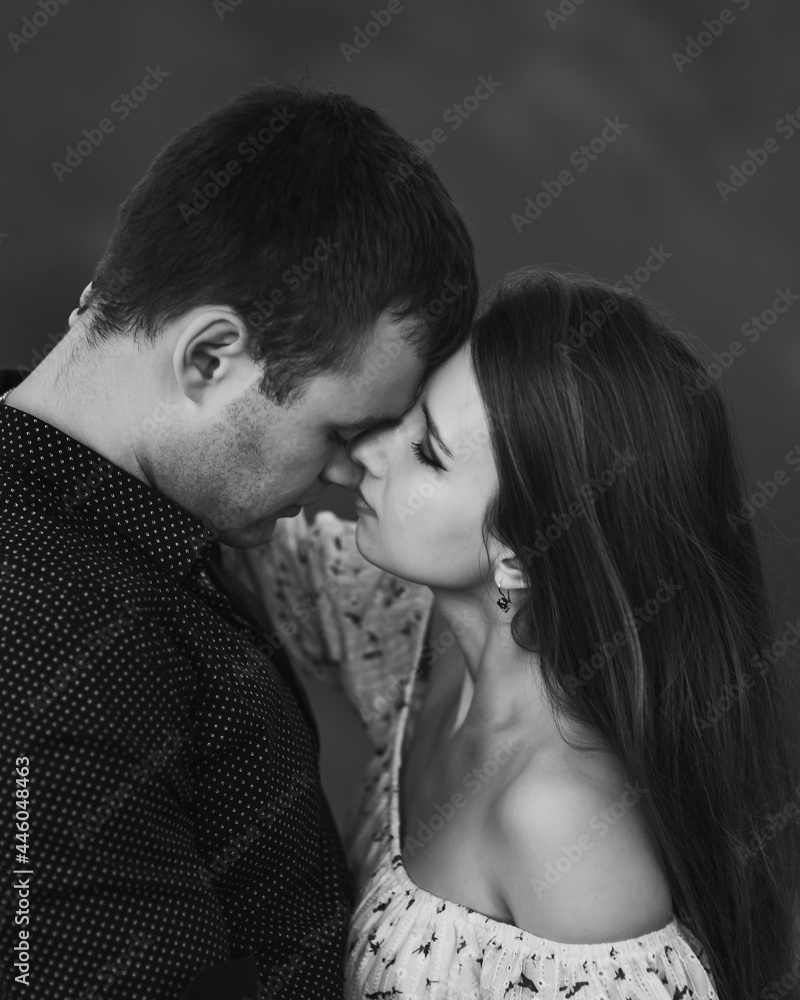 Close up sensual portrait of young couple in love, together, face to face. Black and white Close up sensual portrait of young couple in love, together, face to face. Black and white