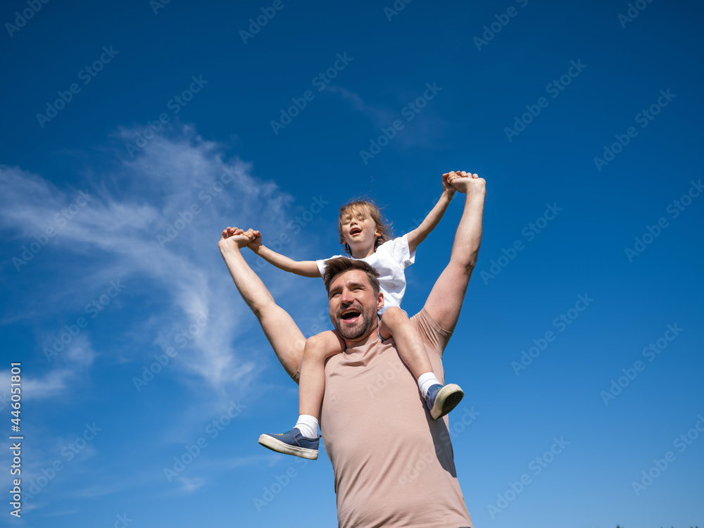 Happy man holding his little daughter Happy man holding his little daughter