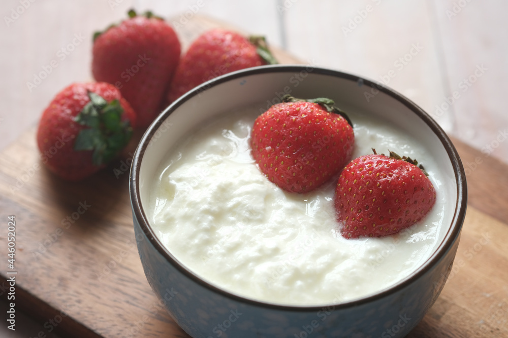 fresh strawberry and yogurt in a bowl on table fresh strawberry and yogurt in a bowl on table