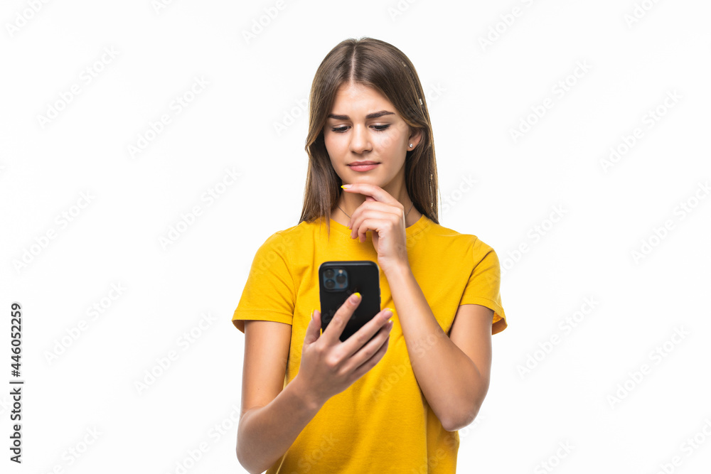 Woman texting on her mobile phone - isolated over a white background Woman texting on her mobile phone - isolated over a white background