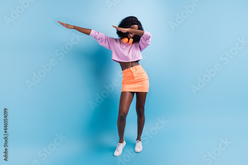 Full size photo of positive dark skin person hands dabbing cover eyes isolated on violet color background photo