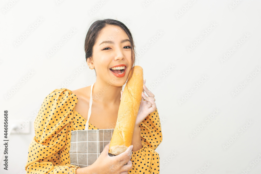 Woman holding bread happy in shop small business Woman holding bread happy in shop small business