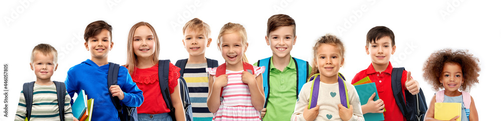 education, learning and people concept - group of happy smiling international children with school bags over white background - obrazy, fototapety, plakaty 