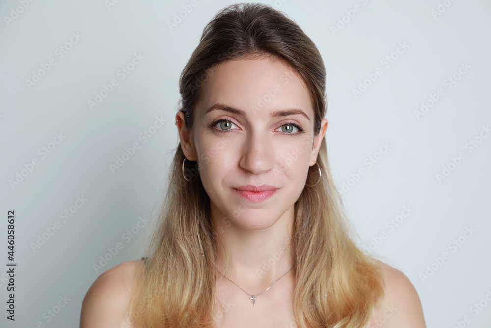 Portrait of beautiful woman on light background Portrait of beautiful woman on light background