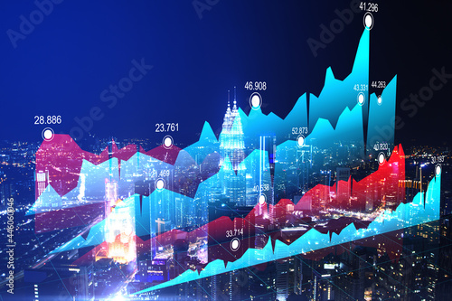 Creative business chart on glowing night city background. Trade and market concept. Double exposure.