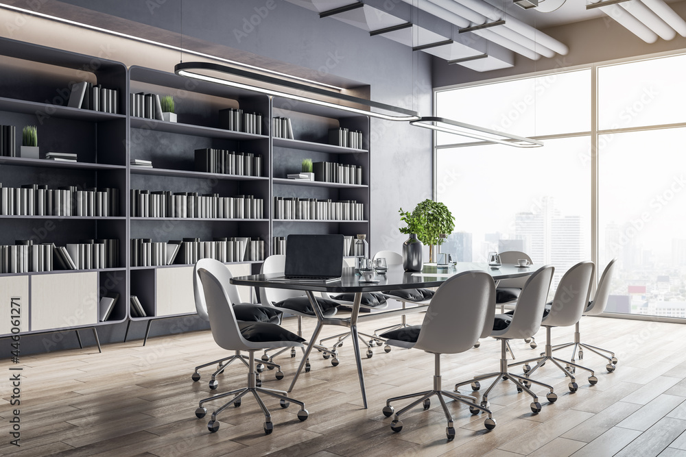 Modern sunny conference table with white tables around on wooden floor in spacious hall room with huge library on the wall and city view from big window