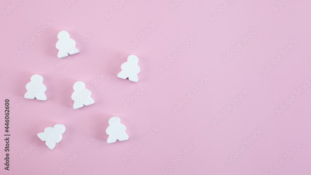 Building a strong team, wood person model on pastel pink background. Building a strong team, wood person model on pastel pink background.