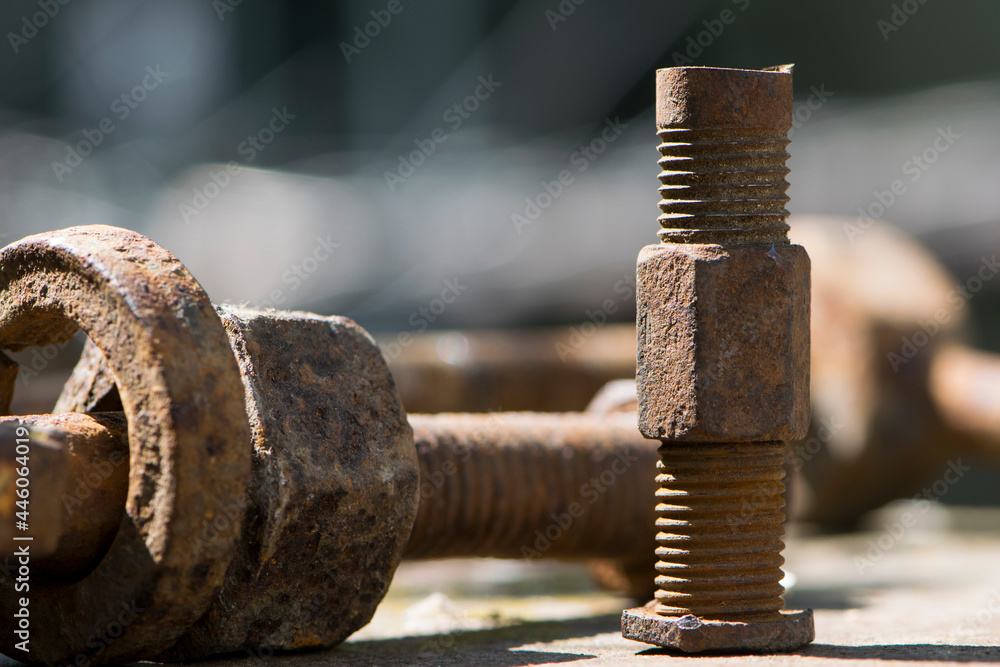 old rusty bolt, iron rod with screw threads. Rusted mechanical components. threaded bolt and nut. dismantling concept, difficult to unscrew, non-removable. selective focus, close-up, macro old rusty bolt, iron rod with screw threads. Rusted mechanical components. threaded bolt and nut. dismantling concept, difficult to unscrew, non-removable. selective focus, close-up, macro