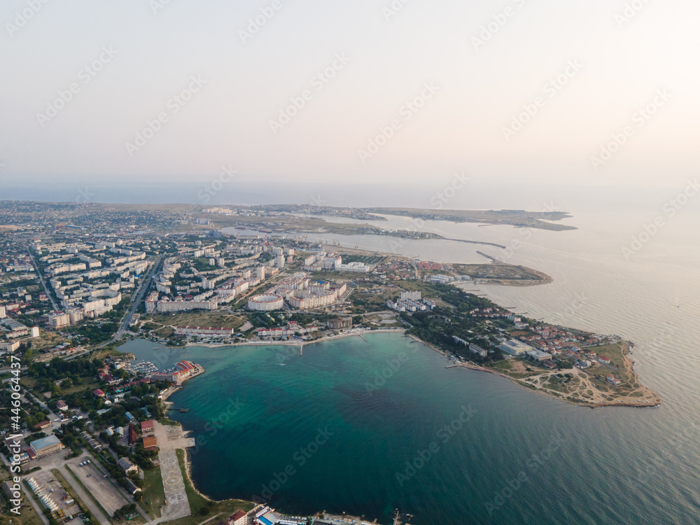 Panorama of the city at sunset. Bird's-eye view of the evening city beach. Black Sea.