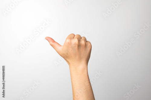 A man's hand making an expression on a white background