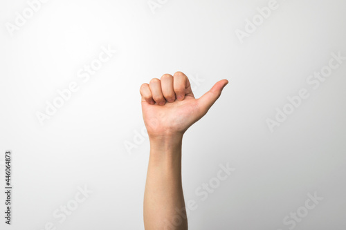 A man's hand making an expression on a white background