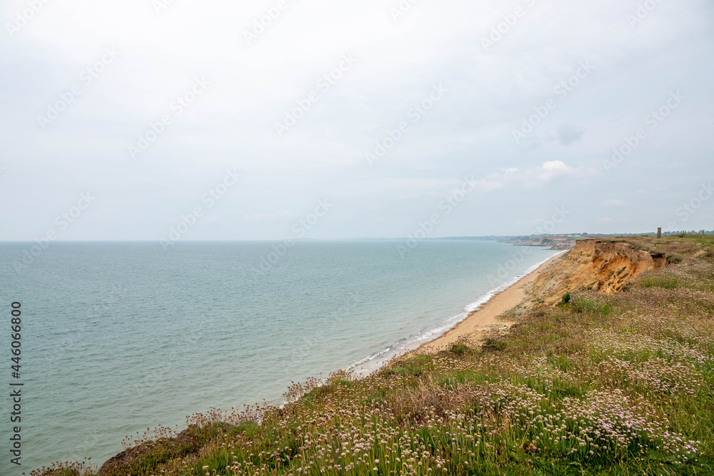view of a deserted English beach from the cliff tops view of a deserted English beach from the cliff tops